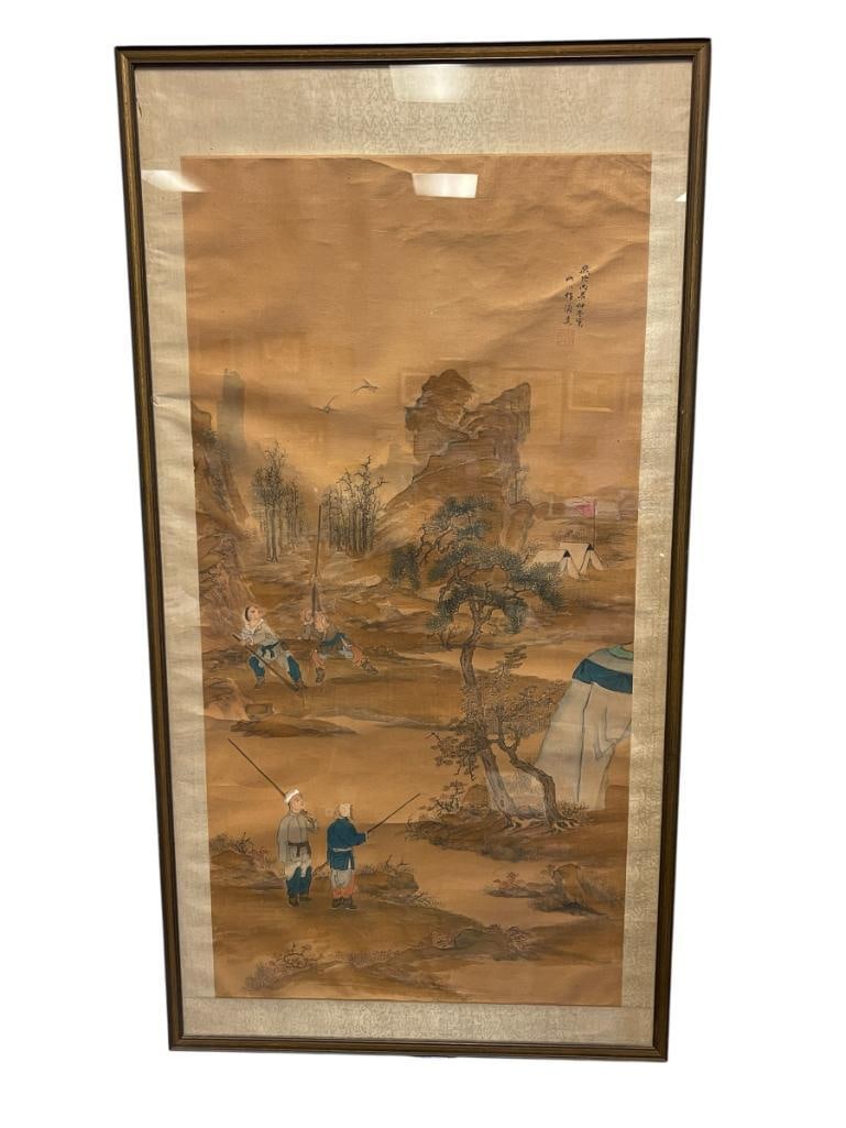19TH CENTURY CHINESE INK AND WASH LANDSCAPE SCROLL PAINTING WITH SILK BORDER: ART DEPICTS MEN HUNTING WITH LONG BARREL MUSKET RIFLES, ARTIST CALLIGRAPHY UPPER RIGHT WITH SEAL, FRAMED BY GRUNDIDGE'S RENO, NV 57" X 47" FRAME 