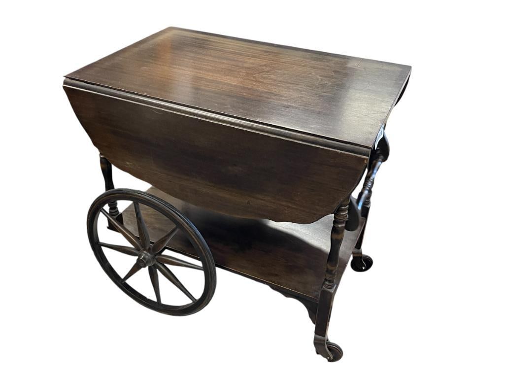 VINTAGE MID-CENTURY IMPERIAL GRAND RAPIDS, MICHIGAN MADE DARK STAINED WALNUT DROP LEAF TEA CART: OVERALL GOOD CONDITION, MINOR FLAW IN WOOD ON TOP OF TABLE, MAKER'S LABEL ON BOTTOM 27" X 18" X 26"