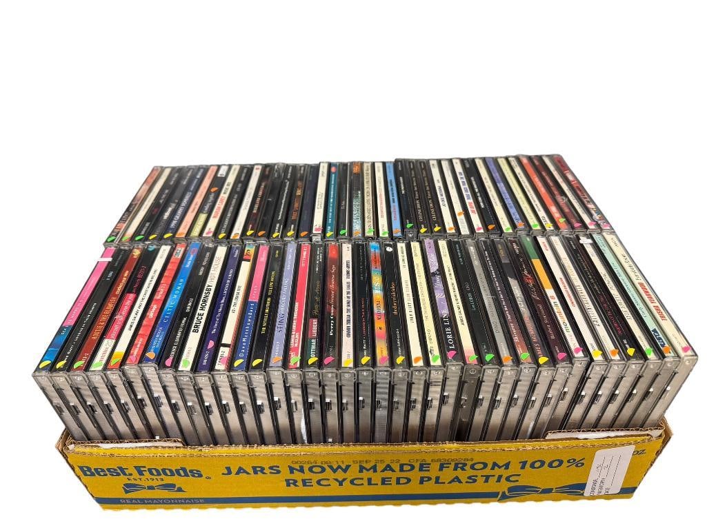 APPROX. 75 MUSIC CD'S IN ORIGINAL CASES FROM VARIOUS GENRES: SEE PHOTOS FOR TITLES 
