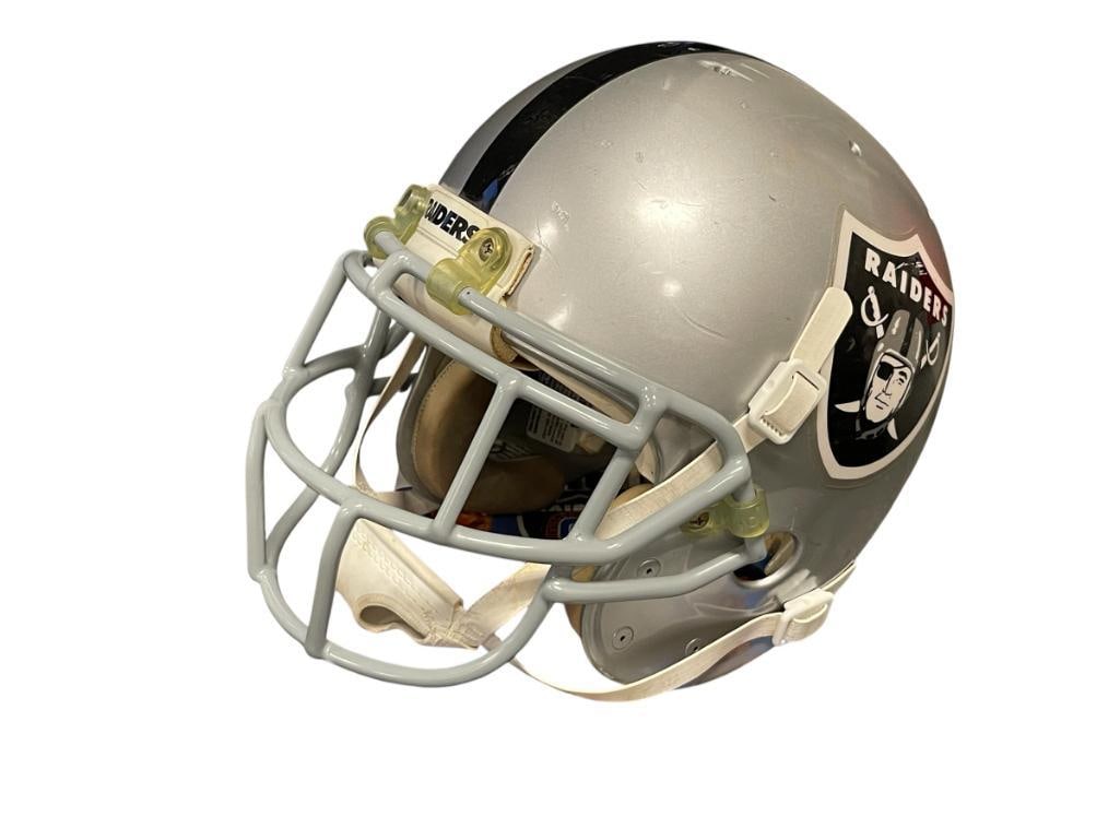 OAKLAND RAIDERS NO. 29 HOF ERIC DICKERSON GAME WORN FOOTBALL HELMET: BELIEVED TO HAVE BEEN WORN BY ERIC DICKERSON WHO PLAYED FOR THE RAIDERS IN 1992, 1999 HALL OF FAME INDUCTEE, SCHUTT MANUFACTURED HELMET WITH 1990 RECERTIFICATION LABEL, SHOWS WEAR FROM PLAY AND AGE, P