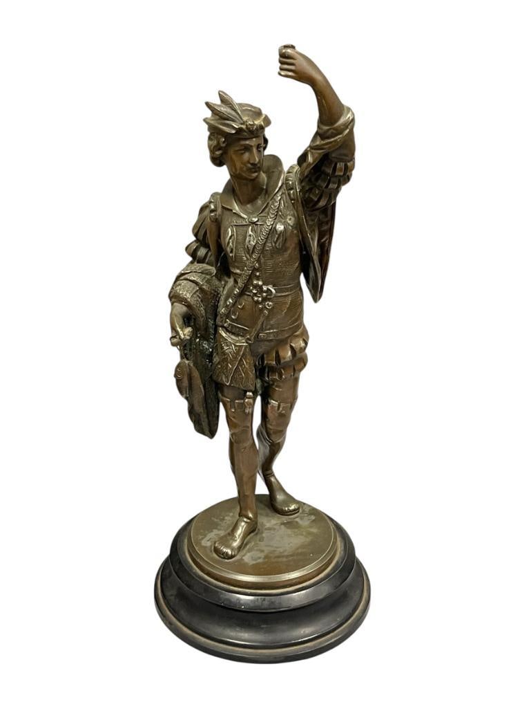 19TH CENTURY METAL SCULPTURE OF A SPANISH CONQUISTADOR OR CAVALIER: ART DEPICTS SPANISH MAN STANDING HOLDING FISH, MOUNTED ON METAL STEPPED BASE, MISSING ITEM IN LEFT HAND 15 3/4" H