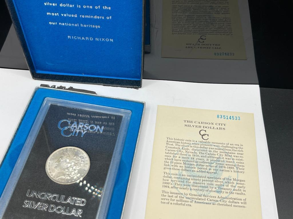 1882-CC UNCIRCULATED U.S. MORGAN SILVER DOLLAR IN GSA HOARD BLACK AND BLUE CASE WITH CERTIFICATE - 9