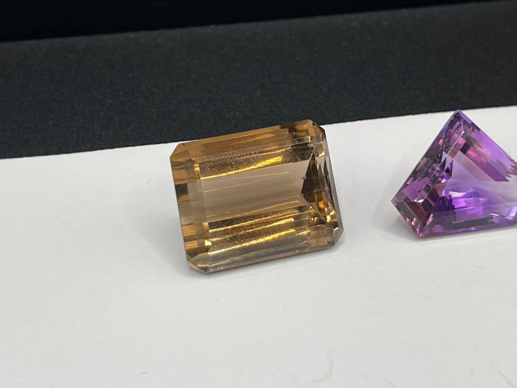 THREE LOOSE GEMSTONES INCLUDING TWO SMOKEY QUARTZ AND AN AMETHYST - 2