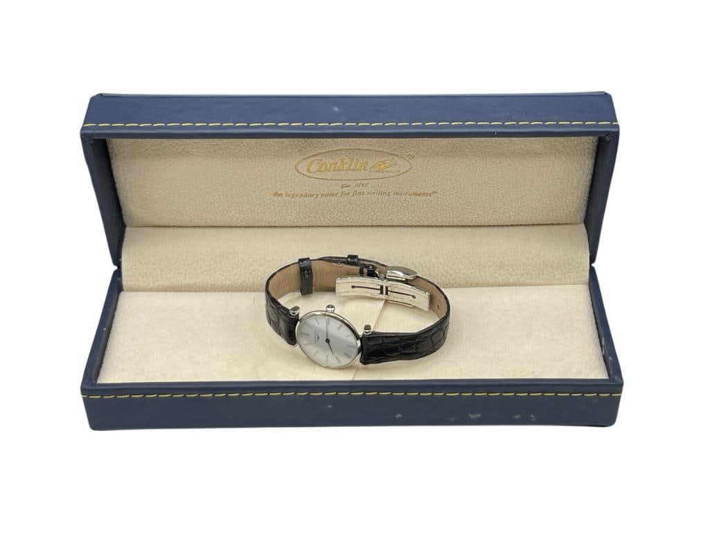 LONGINES LADIES MECHANICAL WRISTWATCH: FEATURING BLACK LEATHER BAND, IN CONKLIN JEWELRY BOX, RUNNING CONDITION 24MM CASE