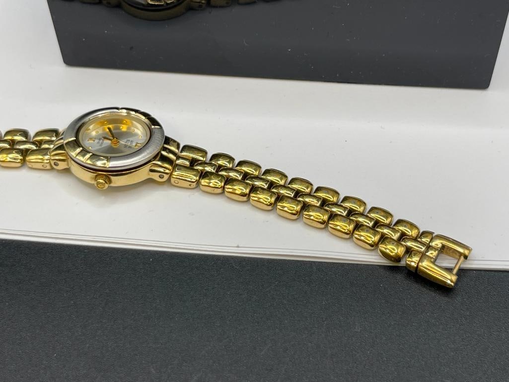 ANNE KLEIN GOLD TONE STAINLESS STEEL DESIGNER LADIES WRISTWATCH WITH ONE DIAMOND DIAL - 9