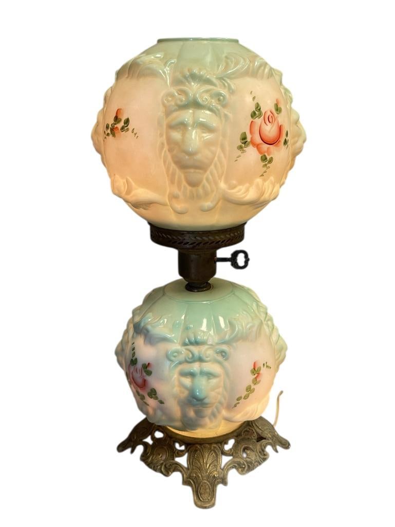 SCULPTED GLASS GONE WIITH THE WIND VICTORIAN GLASS PARLOR LAMP: LION HEAD SCULPTED LAMP WITH HAND PAINTED FLORAL DESIGN, CAST METAL BRASS BASE, MATCHING TOP SHADE, MISSING CHIMNEY 19 1/2" H
