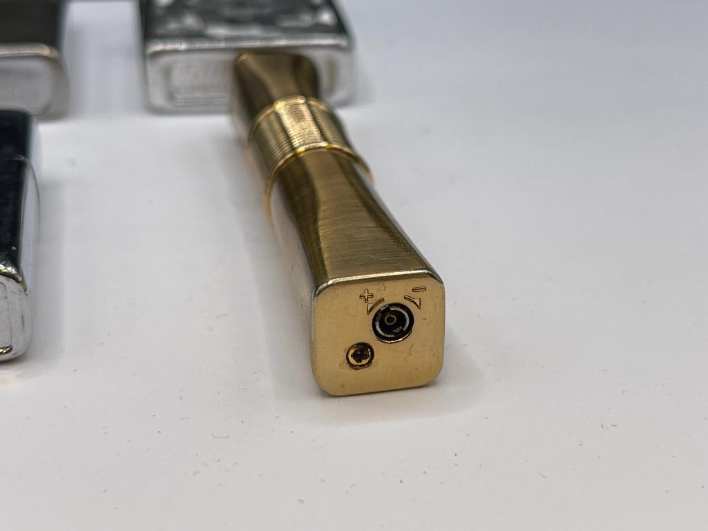 FOUR VINTAGE LIGHTERS INCLUDING ZIPPO STYLE STORM KING AND GOLD TONE LIGHTER - 3