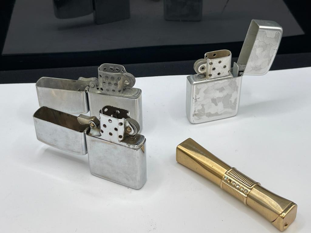 FOUR VINTAGE LIGHTERS INCLUDING ZIPPO STYLE STORM KING AND GOLD TONE LIGHTER - 9