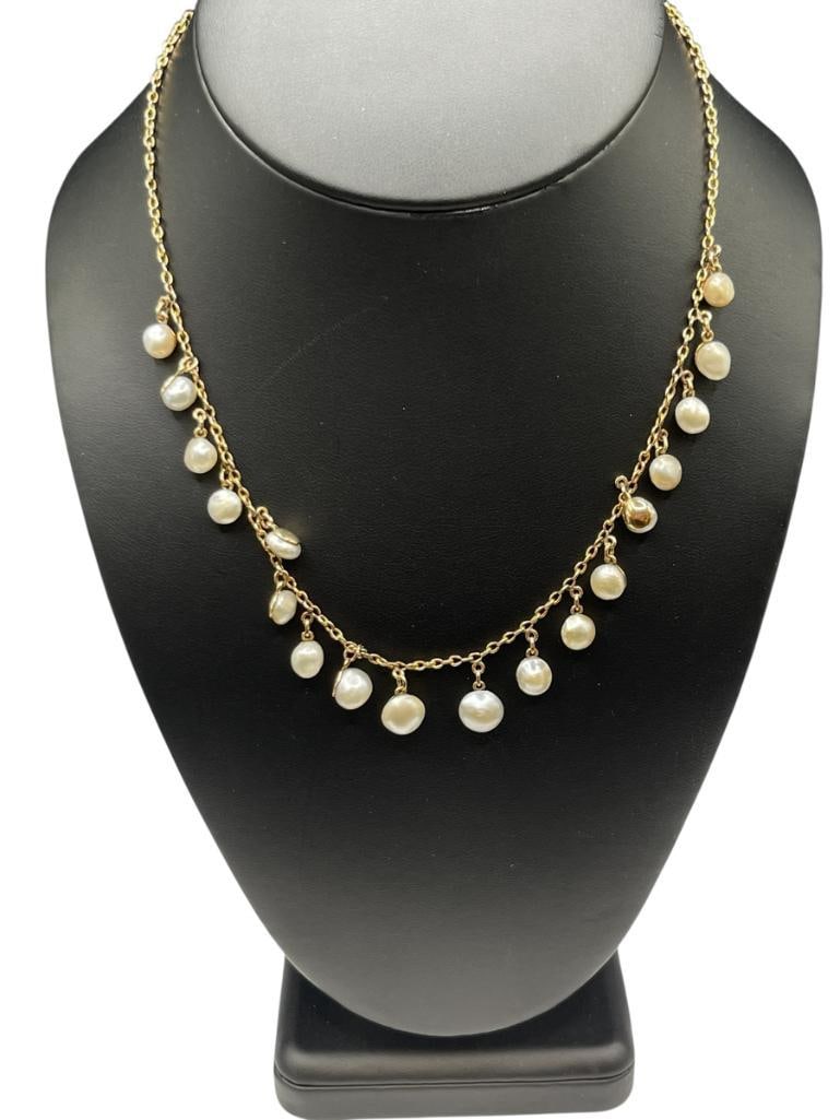 PEARL NECKLACE FEATURING 18 PEARLS SET IN YELLW GOLD CHAIN NECKLACE MARKED "15": NECKLACE FEATURES 18 GRADUATED PEARLS, INCLUDES GIA CERTIFICATE, BAROQUE AND BUTTON SHAPED PEARLS, INCLUDES JEWELS AT SOTHEBY'S FELT CASE 16", UP TO 8MM PEARLS, 16.26 GRAMS 