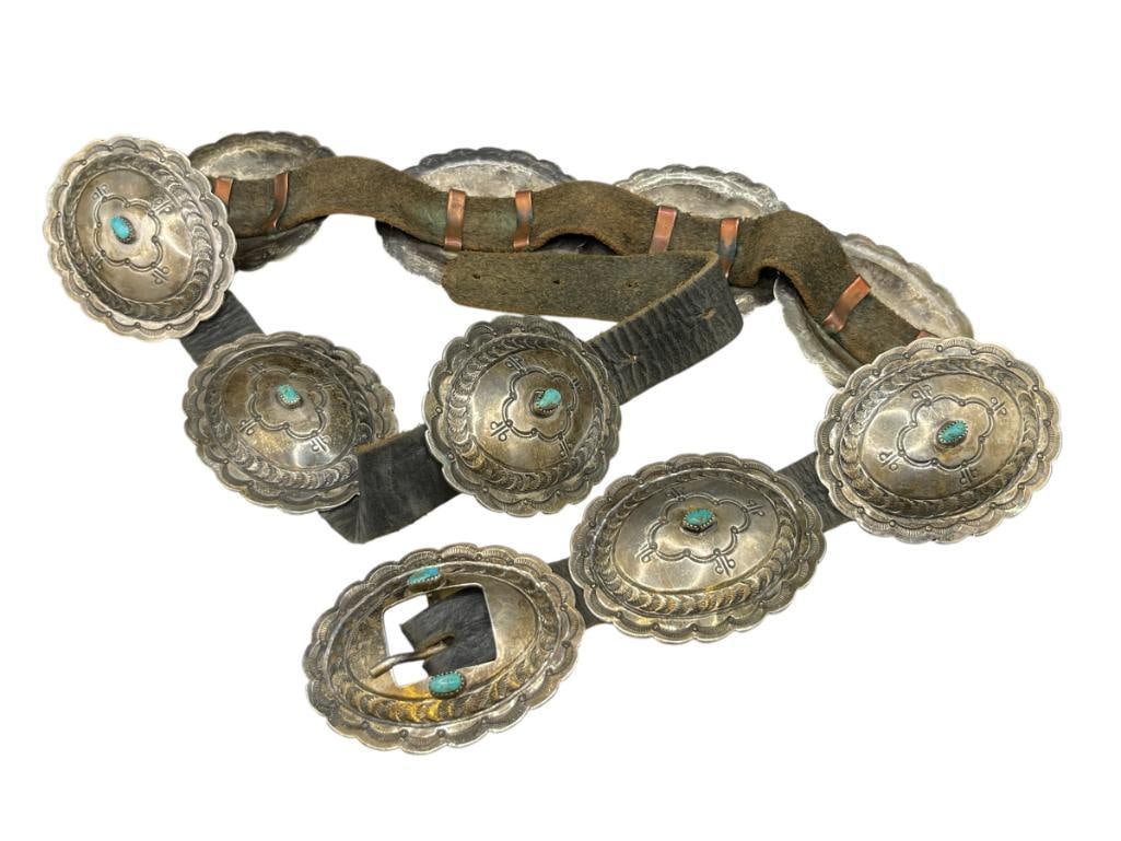 ANTIQUE NAVAJO STERLING SILVER TURQUOISE CONCHO BELT: FEATURING 10 STERLING SILVER CONCHOS EACH ACCENTED WITH TURQUOISE AND STAMPED DESIGN EACH CONCHO IS 3", BELT IS 36" TO 40"