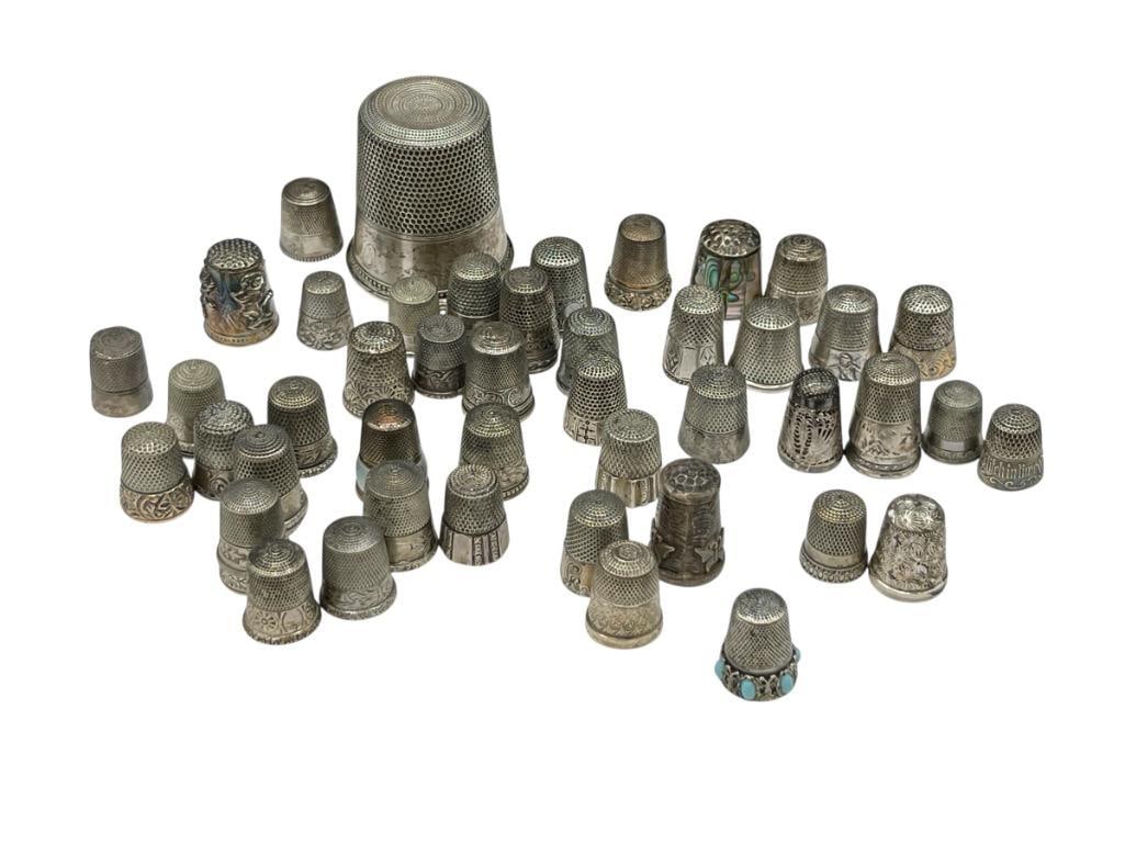 IMPRESSIVE STERLING SILVER THIMBLE COLLECTION FEATURING VARIOUS SIZED THIMBLES: INCLUDES THIMBLE COLLECTOR'S BOOKS AS WELL 267.3 GRAMS 