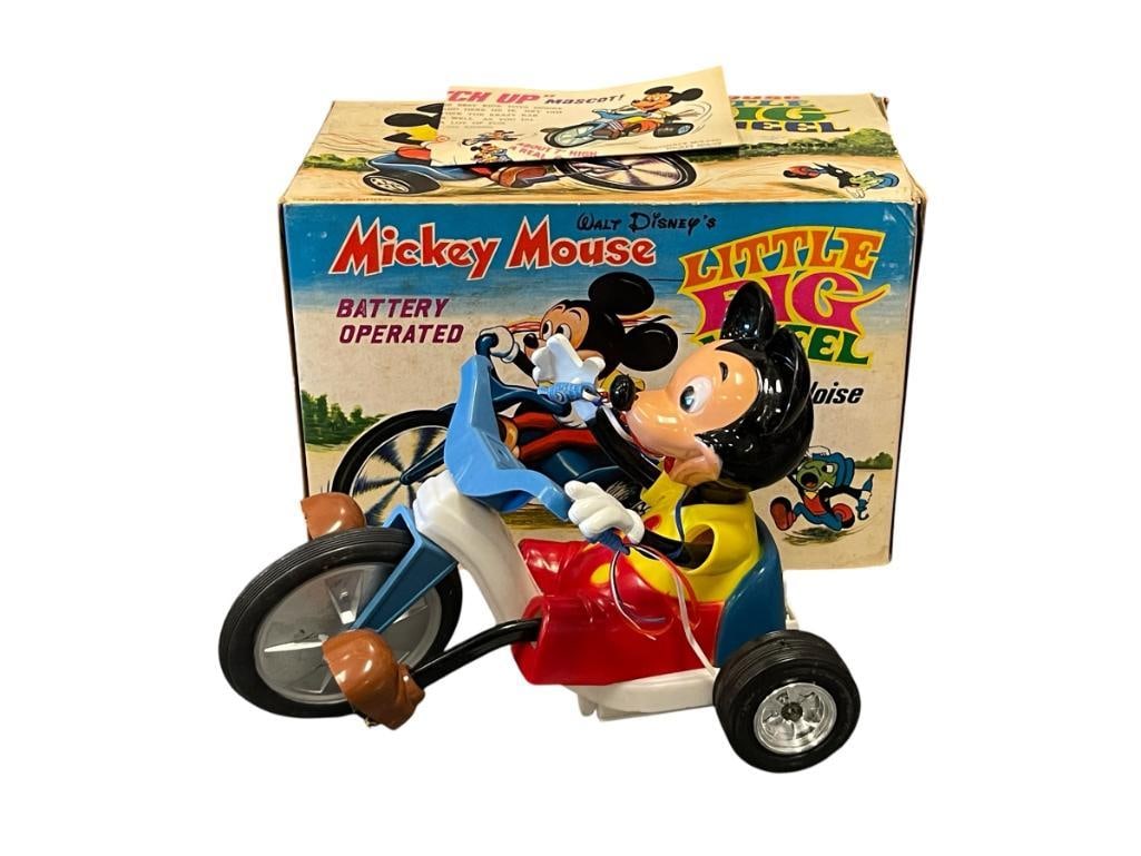 1973 MARX DISNEY MICKEY MOUSE LITTLE BIG WHEEL BATTERY OPERATED TOY: PLASTIC BATTERY OPERATED MECHANICAL TOY WITH ORIGINAL BOX AND GUIDE, MICKEYS RIGHT ARM NEEDS REPAIR 9 1/2" L