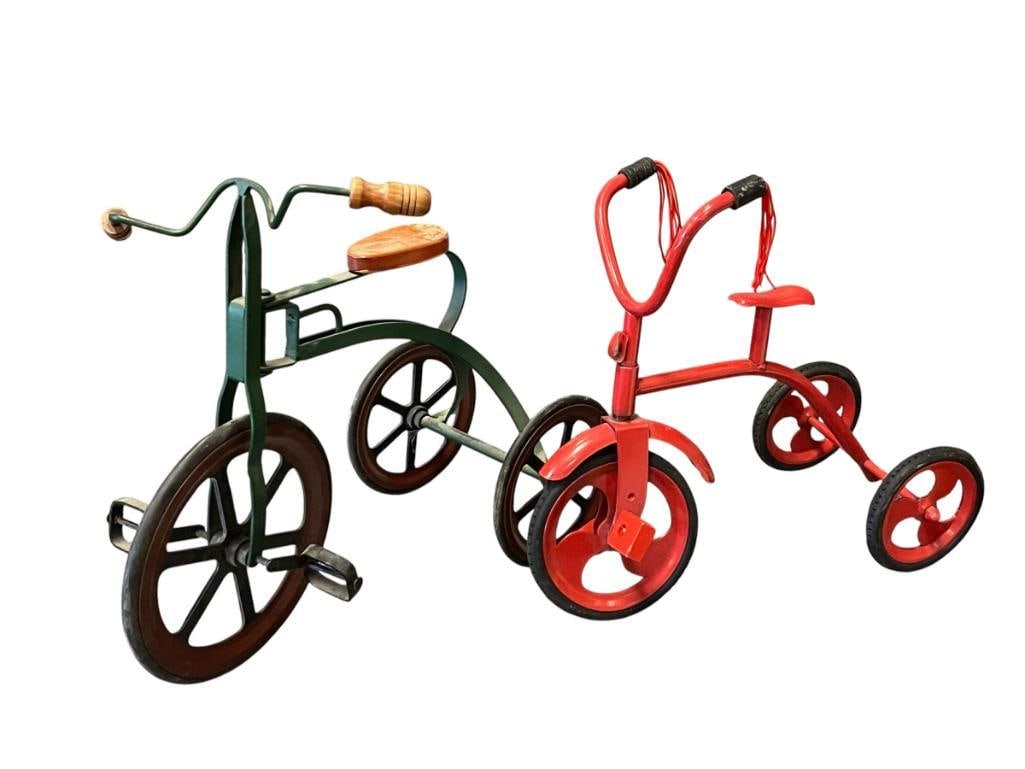 TWO VINTAGE STYLED CHILDRENS TRICYCLES FOR DOLLS: RED AND GREEN METAL FRAMES WITH HARD RUBBER TIRES 10" AND 11" H 