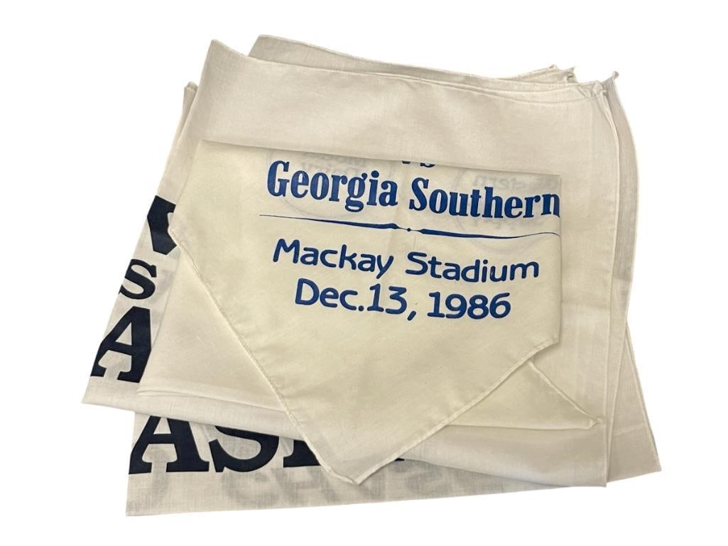NEVADA WOLF PACK 1986 AND 1997 FOOTBALL BANNERS: NEVADA WOLF PACK NEVADA VS NEBRASKA MARCH 18, 1997 AND NEVADA VS GEORGIA SOUTHERN DEC. 13, 1986, ALL BLUE AND WHITE BANNERS 20" X 20" 