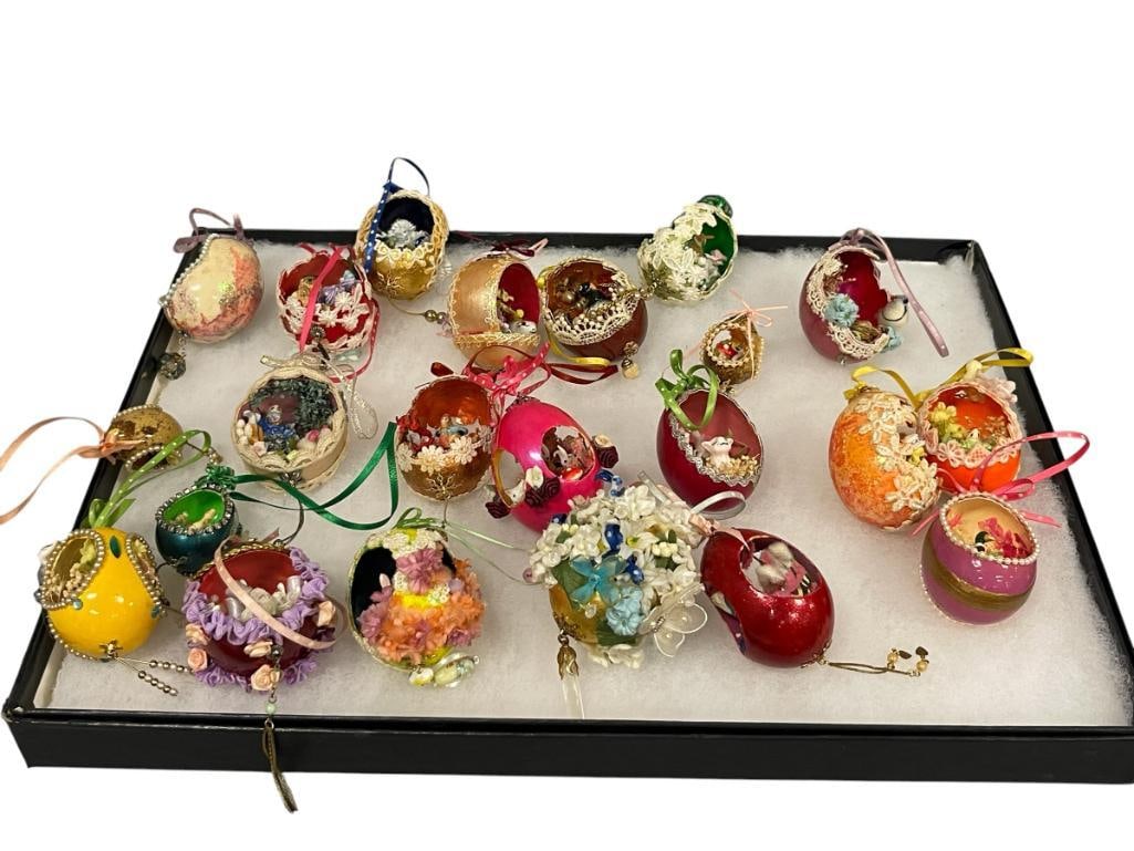 22 HAND DECORATED CHICKEN AND QUAIL EGGS WITH MINIATURE DIORAMAS: EACH EGG HAS BEEN HAND DECORATED WITH DIORAMAS, EXTERIOR OF EGGS HAVE LACE OVERLAY, GLITTER, RIBBON, FLORAL ARRANGEMENTS, ETC. 1 1/2" UP TO 2 1/4" 