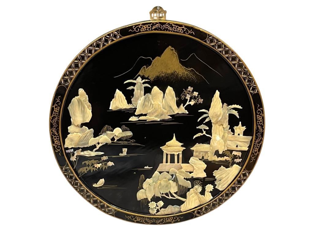 VINTAGE CHINESE LACQUERED WOOD ROUND PANEL WITH MOTHER OF PEARL LANDSCAPE / MOUNTAIN SCENE: CHINESE ROUND LACQUERED WOOD PANEL WITH MOTHER OF PEARL AND GILT DESIGN LANDSCAPE AND MOUNTAIN SCENE, DECORATIVE PIERCED BRASS HANGER, AS FOUND MISSING PIECES OF MOTHER OF PEARL 19 1/2" ROUND 
