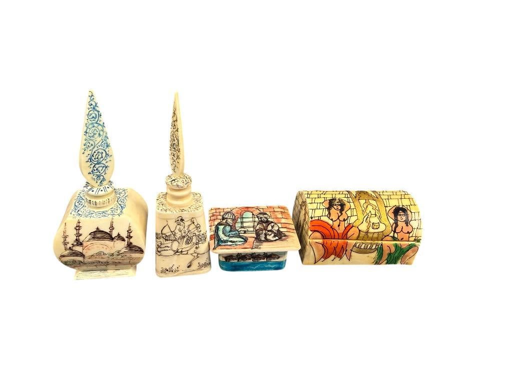 20TH CENTURY HAND CARVED CAMEL BONE TRINKET BOXES AND PERFUME BOTTLES FROM ISTANBUL: TWO HAND DECORATED TRINKET BOXES WITH PAINTED FIGURES INCLUDING PROVOCATIVE SCENE AND TWO HAND HAND DECORATED PERFUME BOTTLES, ONE TRINKET BOX HAS CHIPPED LID 1 3/4" AND 2 1/8" TRINKET BOXES AND