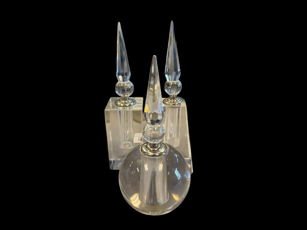 BOMBAY ELEGANT CRYSTAL FRAGRANCE / PERFUME BOTTLES WITH STOPPERS / DAUBERS: THREE PERFUME BOTTLES, EACH WITH STOPPERS WITH ATTACHED GLASS DAUBERS, EACH AHS WATERMARK ON THE BOTTOM, NO CHIPS, ONE DOES NEED TOP GLUED 6" AND 6 3/4" H