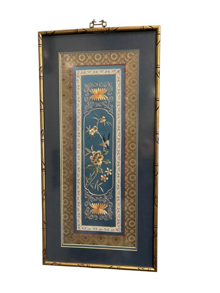 EARLY 20TH CENTURY CHINESE EXPORT HAND MADE SILK PANEL FRAMED BY MAN FONG IN HONG KONG: SILK PANEL DEPICTS BIRD AND FLOWERS WITH A FLORAL BORDER, FRAMED 15" X 31" FRAME 