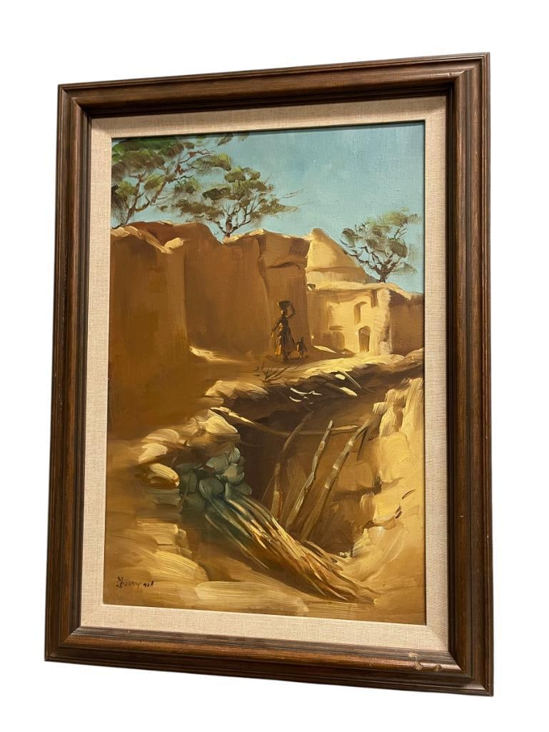20TH CENTURY MIDDLE-EAST ORIGIANL OIL ON CANVAS PAINTING SEMI-ARID REGION: ART DEPICTS SEMI-ARID REGION WITH FIGURE CARRYING VESSEL ON THEIR HEAD WALKING TOWARD A VILLAGE OR SETTLEMENT, SIGNED LOWER LEFT, FRAMED 21 1/4" X 29" 