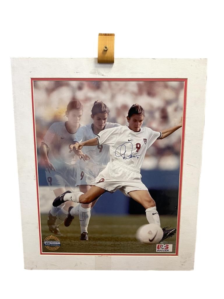 MIA HAMM LIMITED EDITION SIGNED 16X20 PHOTOGRAPH STEINER SPORTS MEMORABILIA: MIA HAMM IS A TWO-TIME OLYMPIC GOLD MEDALIST AND TWO-TIME FIFA WOMEN'S CUP WINNER, INCLUDES CERTIFICATE OF AUTHENTICITY BY STEINER MEMORABILIA, PHOTO DOES SHOW SMALL DENTS ALONG THE TOP, UNFRAMED 20"