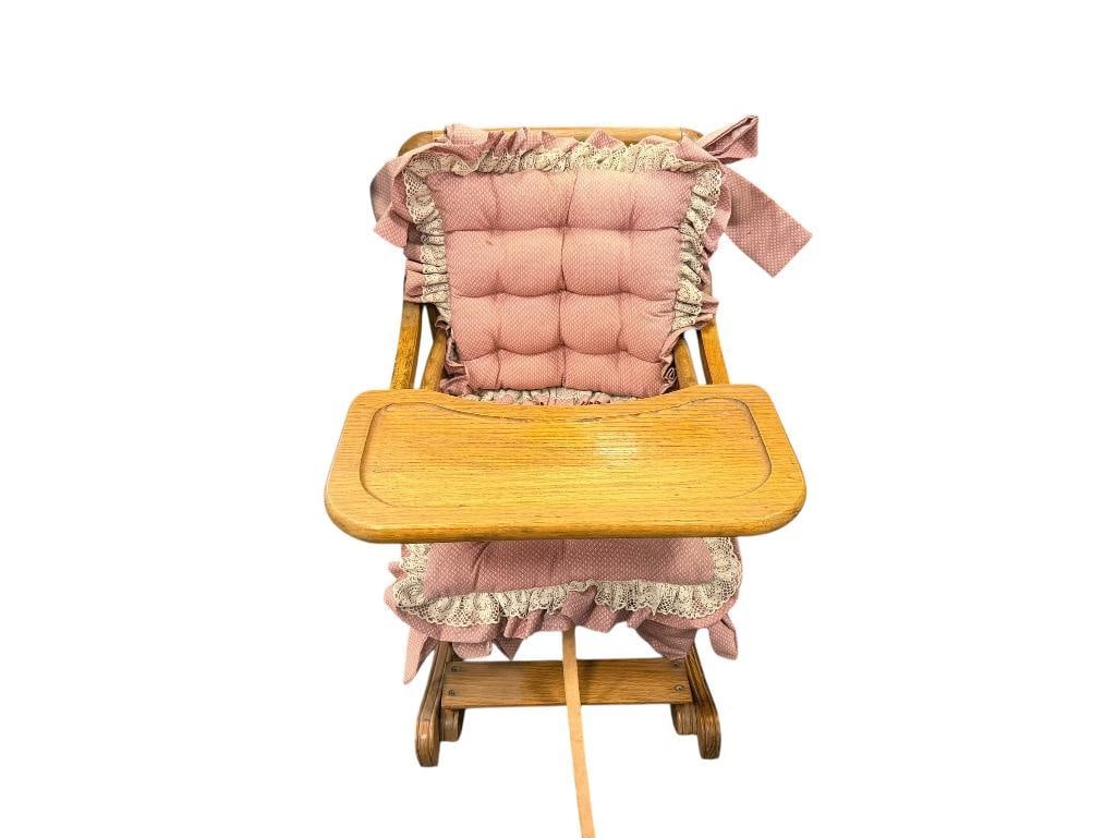 VINTAGE CHILD'S WOOD FRAME ROCKING CHAIR WITH PINK UPHOLSTERY CUSHIONS THAT ARE REMOVABLE: SOLID OAK, CANE SEAT AND BACK, LOW TO THE GROUND ROCKER, UNIQUE FUNCTION FOR ADJUSTING HEIGHT, GOOD CONDITION 18" X 28" X 12" SEAT HEIGHT, 25" SEAT BACK HEIGHT