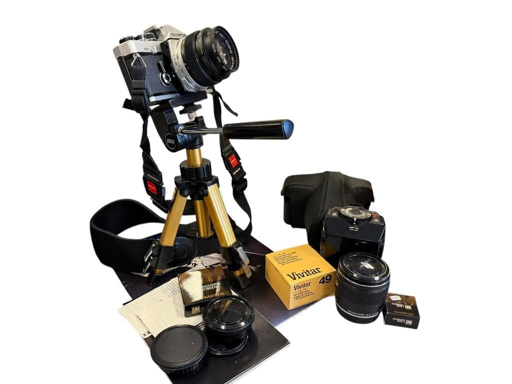 OLYMPUS OM-2 VINTAGE CAMERA AND ACCESORIES INCLUDING TRI-POD: ALSO INCLUDES ADDITIONAL LENS, VIVITAR 49, OLYMPUS FLASH, FOCUSING SCREEN, ACCESSORY SHOE 2, AND MORE, SERIAL # 1158970