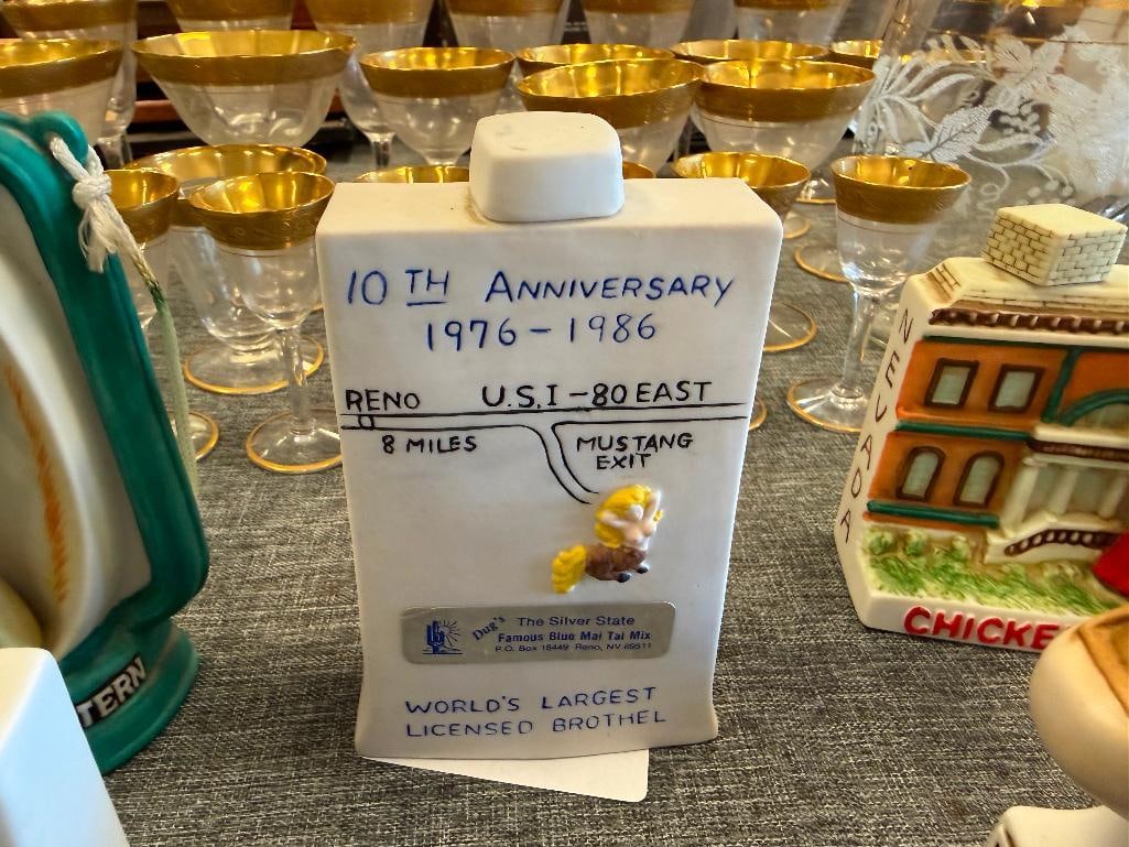 SIX MINIATURE BROTHEL LIQUOR DECANTERS INCLUDING CHICKEN RANCH, JOE CONFORTE'S MUSTANG RANCH, ETC. - 7