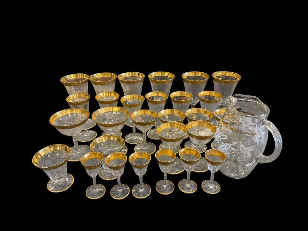 ANTIQUE CIRCA 1930'S TIFFIN FRANCISCAN GOLD ENCRUSTED GLASSWARE STEMWARE SET: FEATURING SIX DIFFERENT TYPES OF GLASSES, FOUR TYPES HAVE COMPLETE SETS OF SIX, TWO OTHERS ONLY HAVE TWO GLASSES EACH, ALSO INCLUDES NON-MATCHING BUT SIMILAR STYLE WATER PITCHER, NO CHIPS OR CRACKS 