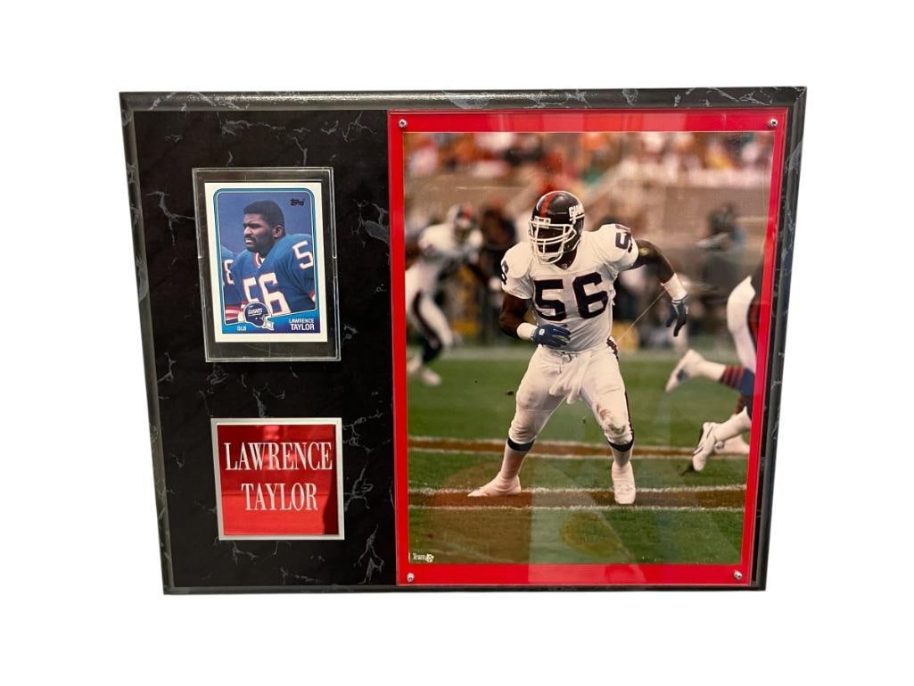 LAWRENCE TAYLOR PHOTOGRAPH PLAQUE WITH 1988 TOPPS CARD AND ENGRAVED PLATE: LAWRENCE TAYLOR WAS A 2X SUPERBOWL CHAMPION PLAYING HIS ENTIRE CAREER FOR NEW YORK GIANTS, 1999 HALL OF FAME INDUCTEE 15" X 12"