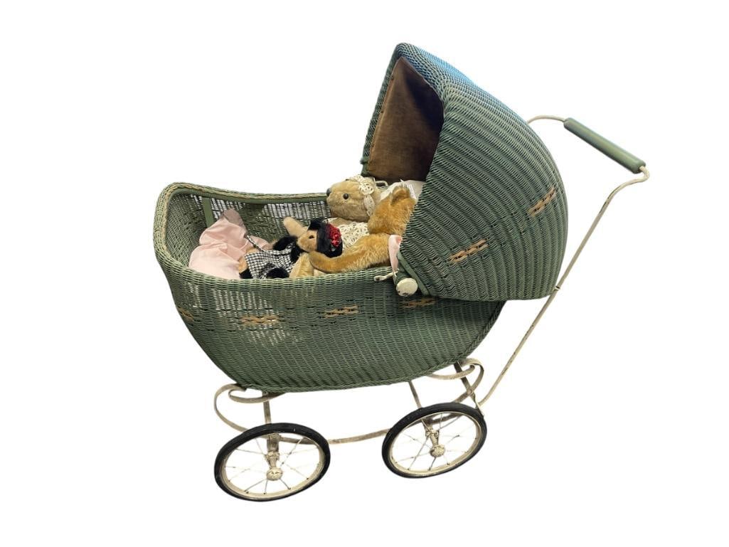 CIRCA 1917 LLOYD LOOM PRODUCTS WIKER AND METAL BABY CARRIAGE: GREEN WICKER BABY CARRIAGE WITH ANTIQUE WHITE METAL FRAME, ORIGINAL LABELS ON THE BOTTOM, MADE MY THE LLOYD MANUFACTURING CO., SHOWS WEAR TO FINISH OVERALL IN GOOD CONDITION AND COMPLETE, INCLUDES