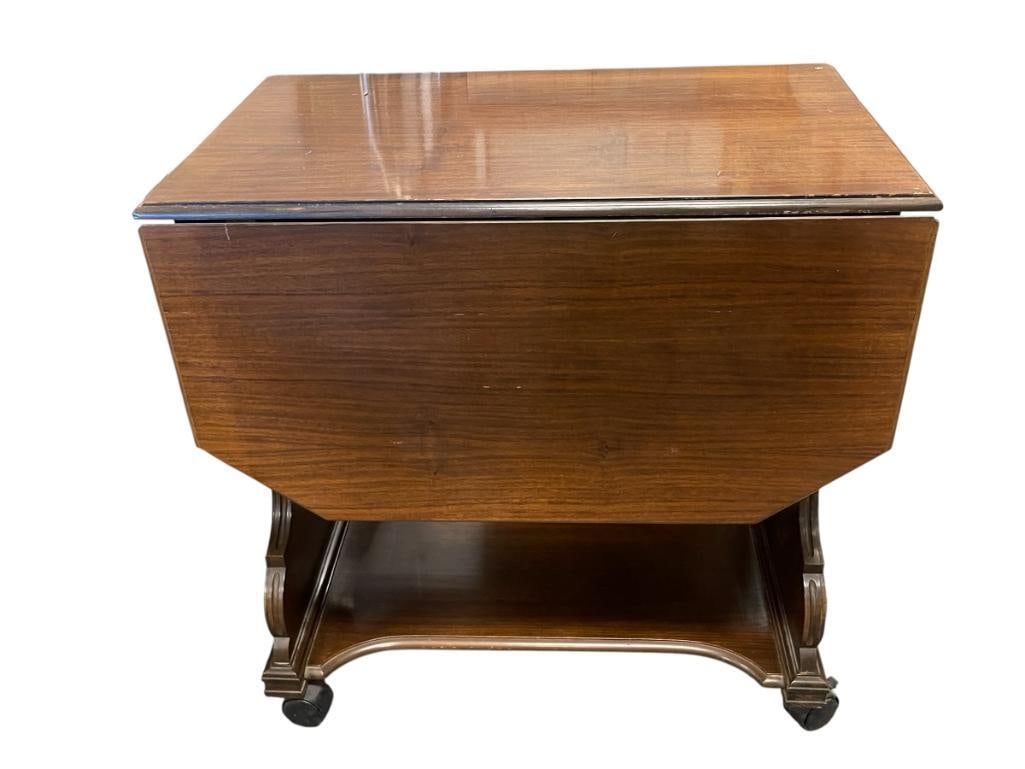 VINTAGE MAHOGANY LYRE SHAPED DROP LEAF ROLLING SERVING CART: FEATURES STORAGE DRAWER WITH PLASTIC CASTORS 44" X 28" X 28" WHEN OPEN