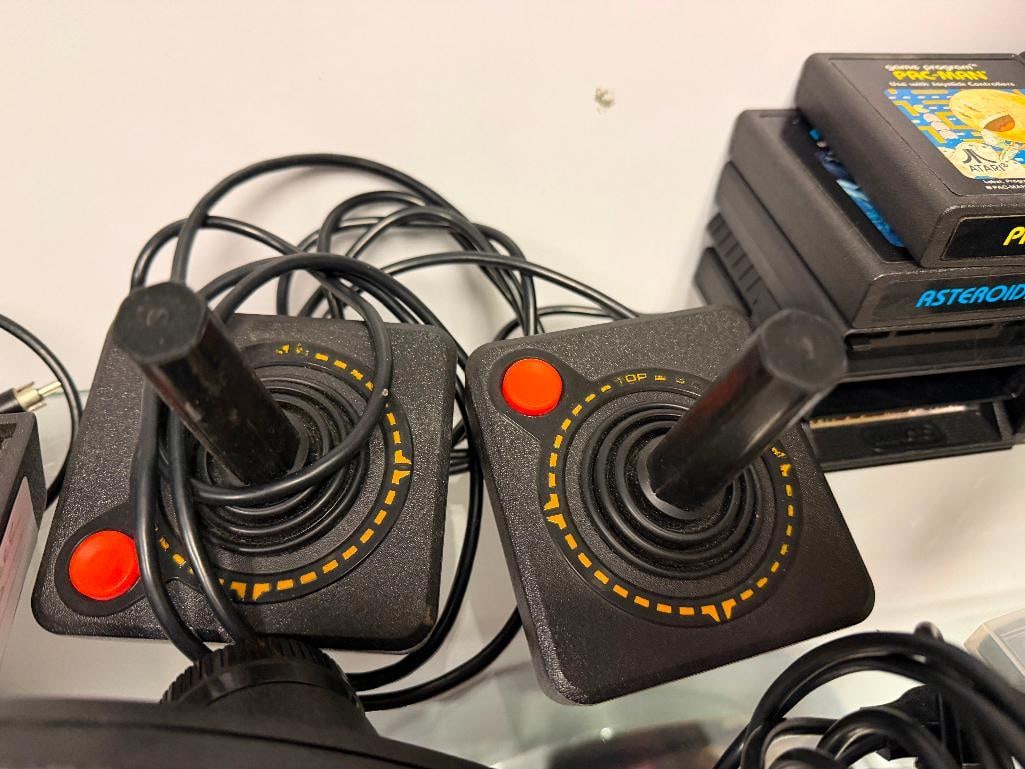 VINTAGE ATARI VIDEO COMPUTER GAMING SYSTEM WITH CORDS, GAMES INCLUDING PAC-MAN, ASTEROIDS, AND MORE - 8