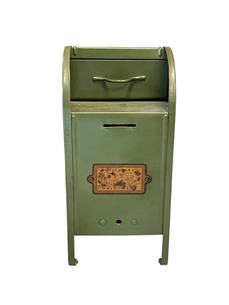 MID-CENTURY 1950'S THE ALL-AMERICAN MAILBOX COIN BANK PRESSED STEEL: MADE FROM PRESSED STEEL AND FINISHED IN GREEN, FEATURES SLOT TOP FOR COINS AND LEVER TO DEPOSIT PAPER MONEY, ORIGINAL DECALS PRESENT, BUT DO SHOW WEAR AND DISCOLORING, OVERALL IN GOOD CONDITION WITH