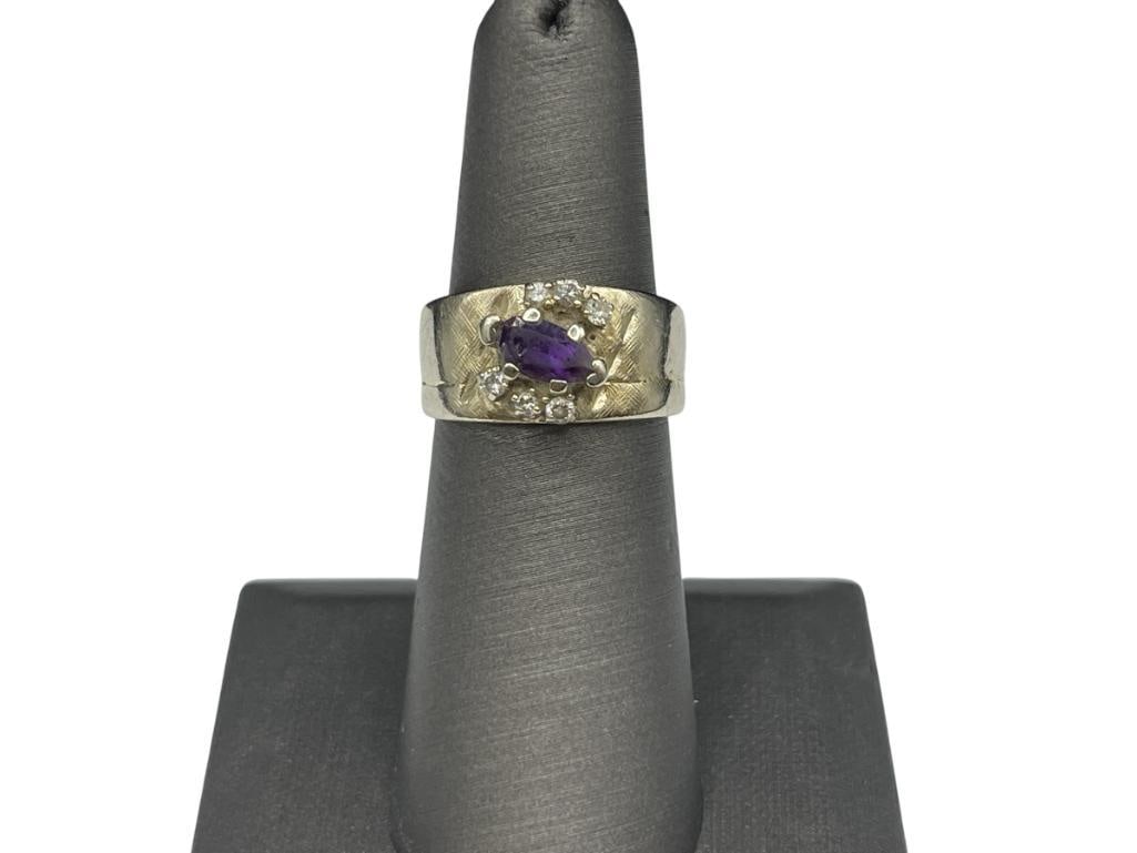14K YELLOW GOLD AMETHYST AND DIAMOND FASHION RING: FEATURING A PEAR CUT AMETHYST THAT HAS A CHIP AND SIX ROUND BRILLIANT CUT DIAMONDS, MULTI-BAND DESIGN, HALLMARKED BY DESIGNER "TFTRA" SIZE 6, 3/8" FRONT, 7MM AMETHYST, 2MM DIAMONDS, 5.79 GRAMS 