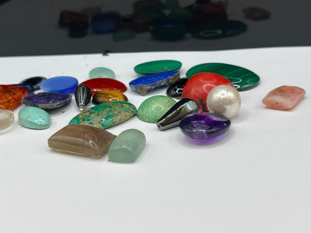 ASSORTED GEMSTONES FEATURING MALACHITE, AMBER, AMETHYST, CORAL, AND SIMULATED STONES - 6