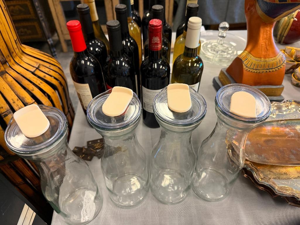 SET OF FOUR GLASS BOTTLES WITH PLASTIC TOPS - 3