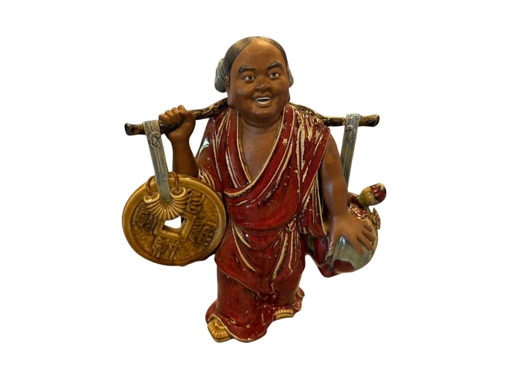 CHINESE SHIWAN POTTERY FIGURE SHIWAN KILNS GUANGDONG PROVINCE MUD MAN FIGURE OXBLOOD GLAZE: TRAVELING MONK CARRYING COIN AND FRUIT, SYMBOLIZES WEALTH, PROSPERITY, AND GOOD FORTUNE,MARKED ON THE INSIDE 13 1/2" H 
