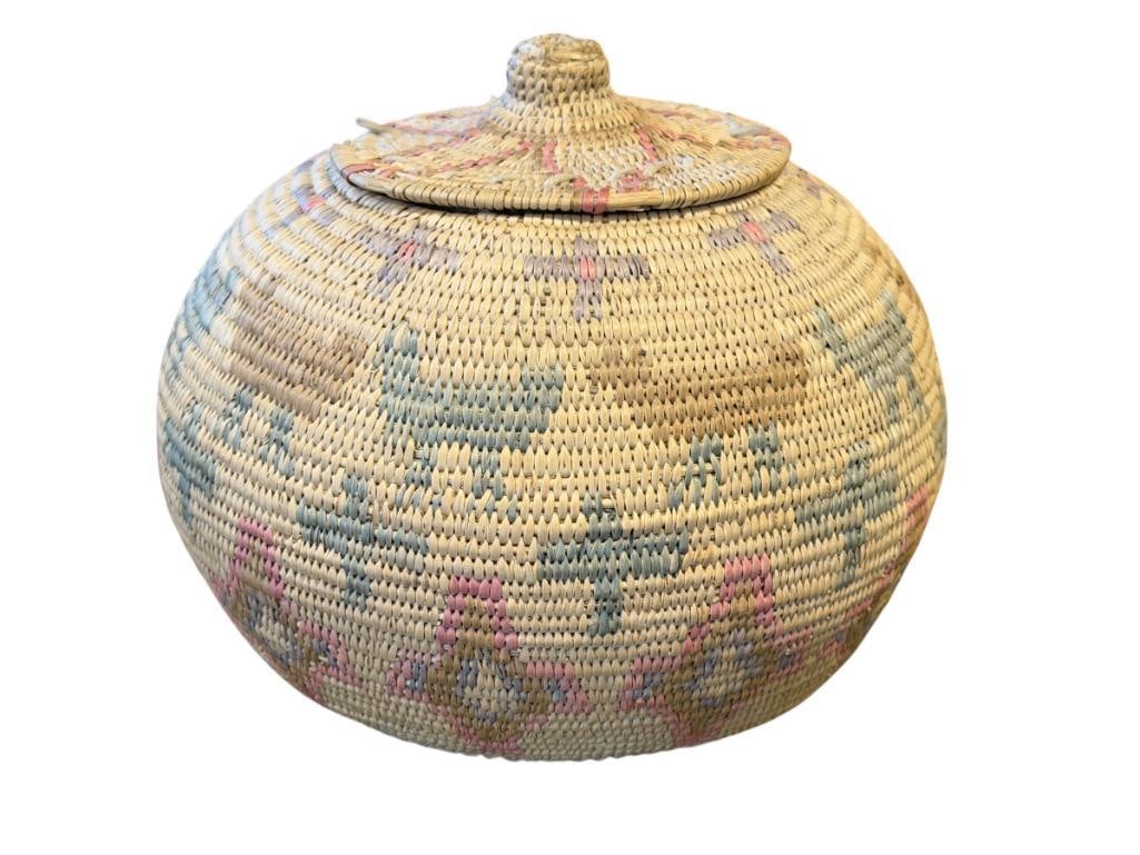 EARLY 20TH CENTURY LATE 19TH CENTURY PAIUTE / WASHOE NATIVE AMERICAN POLYCHROME LIDDED BASKET: HAND WOVEN BASKET WITH LID, GEOMETRIC AND ANIMAL DESIGN, BASKET SHOWS MINOR FRAYING, LID DOES SHOW FRAYING ON THE EDGE 8 1/2" ROUND, 7" H