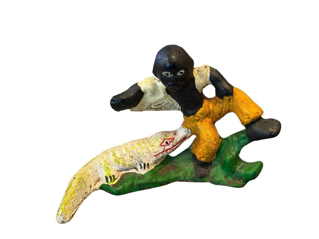 VINTAGE BLACK AMERICANA PAINTED CAST IRON ALBINO ALLIGATOR ATTACKING BOY BOTTLE OPENER: ORIGINAL PAINT, POSSIBLY MADE BY WILTON PRODUCTS 3 3/4" L