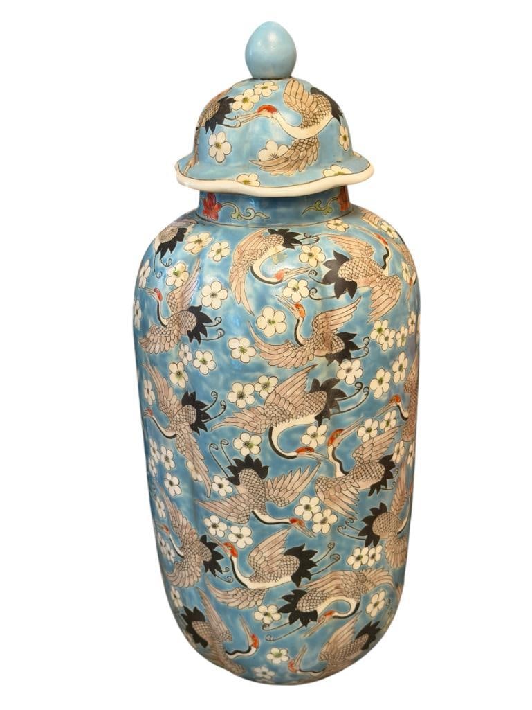 QING DYNASTY HAND PAINTED TALL PORCELAIN GINGER JAR DECORATED WITH CRANES AND FLOWERS: BIRD AND FLORAL MOTIF WITH BLUE BACKGROUND, MARKED ON THE BOTTOM TRANSLATES TO GREAT QING DYNASTY KANGXI EMPEROR PERIOD MADE (1662-1722), INCLUDES TOP, NO CRACKS OR CHIPS 18" H