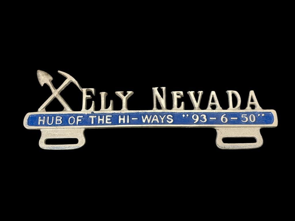 VINTAGE ELY NEVADA HUB OF THE HI-WAYS ALUMINUM AUTOMOBILE LICENSE PLATE TOPPER: IN SILVER AND BLUE, GOOD COLOR, APPEARS TO HAVE NEVER BEEN MOUNTED 11 1/2" X 4"