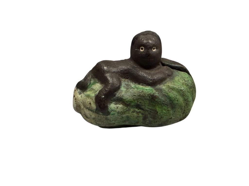 VINTAGE BLACK AMERICAN CAST IRON STILL COIN BANK BABY LAYING ON WATERMELON (1 of 4)