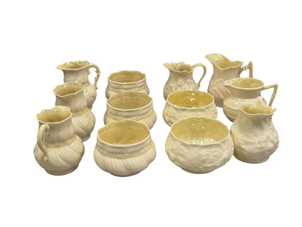 BELLEEK FINE IRISH PARIAN CHINA SUGAR AND CREAMER SETS IN LOTUS AND RIBBON LUSTRE PATTERNS: TOTAL OF FIVE SETS, TWO EXTRA CREAMERS, ONE SUGAR BOWL HAS A "TINY" CHIP ON THE RIM 3" AND 3 1/2" SUGAR BOWLS, 3" AND 3 3/8" CREAMERS