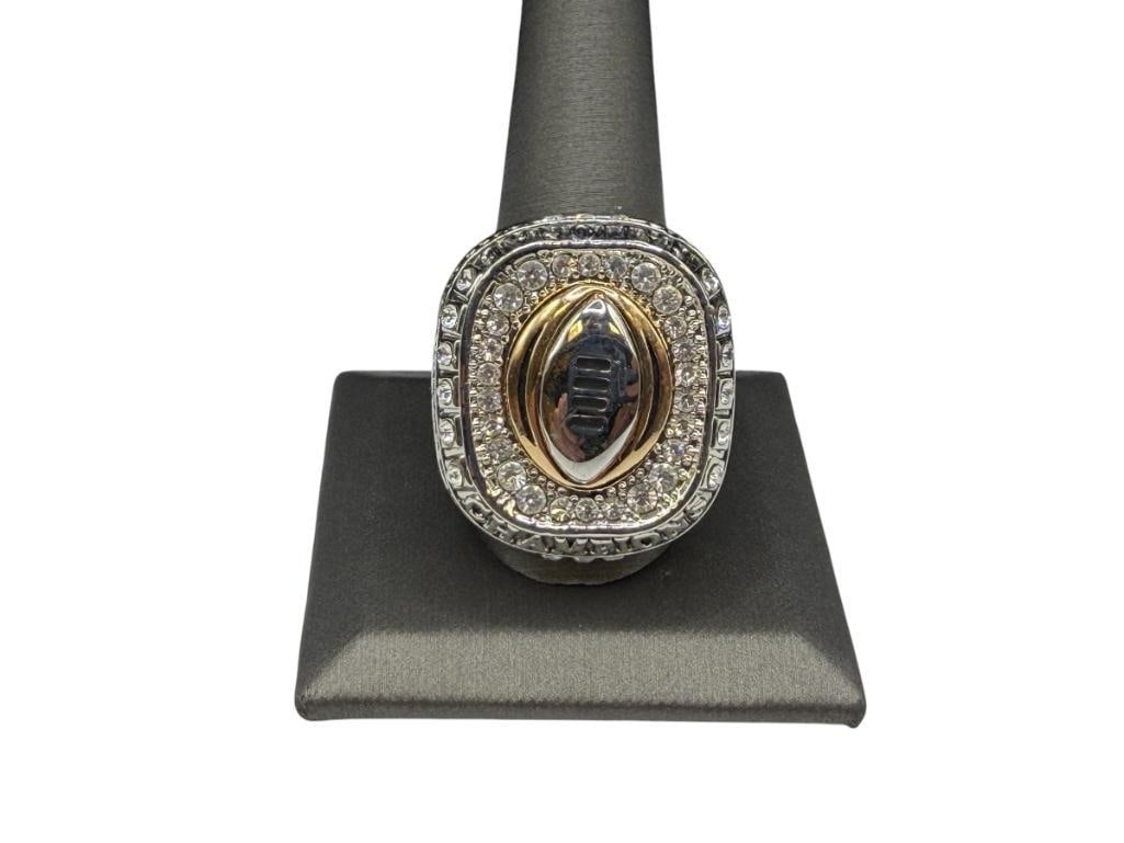 2015 OHIO STATES BUCKEYES EZEKIEL ELLIOTT NCAA COLLEGE CHAMPIONSHIP REPLICA RING: STAINLESS STEEL WITH CLEAR STONE ACCENTS AND BLACK OUT DESIGN, FEATURES STATS FROM GAME, "COLLEGE FOOTBALL PLAYOFF" SIZE 12 1/2, 1 1/4" FRONT