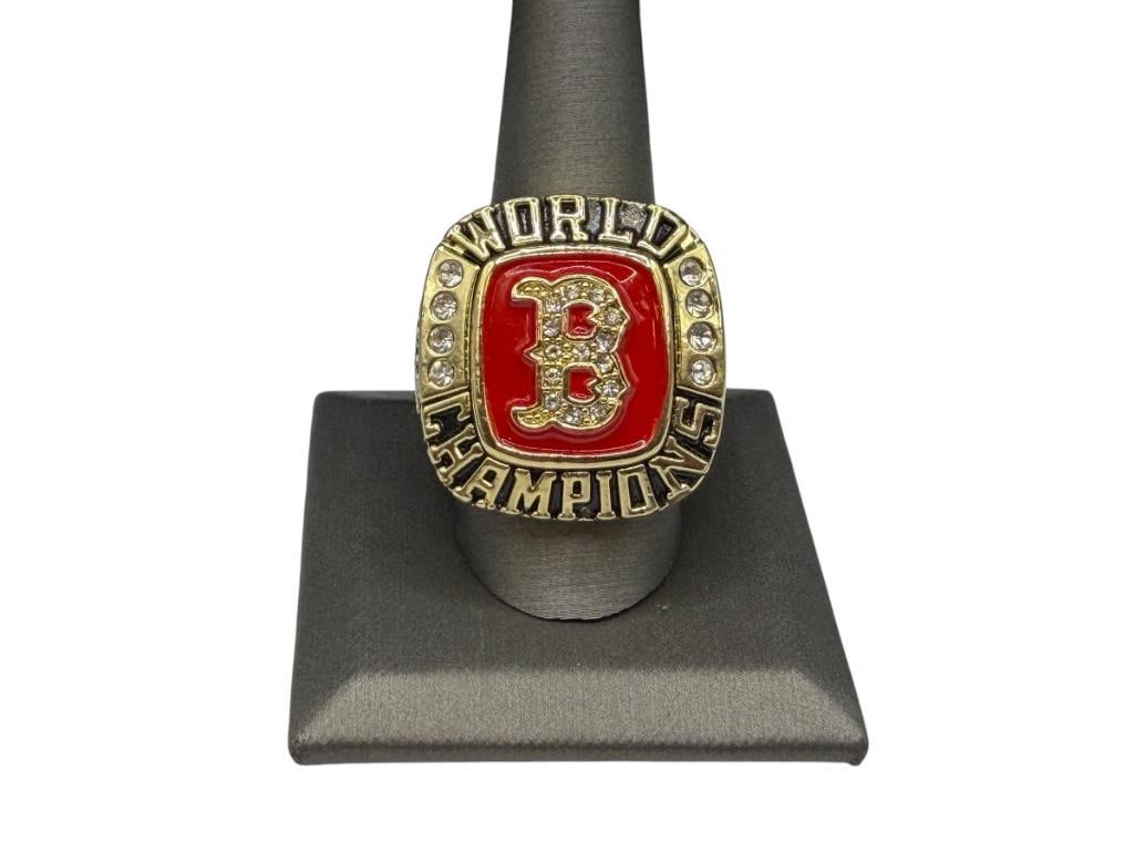 2004 BOSTON RED SOX TEAM MLB WORLD SERIES CHAMPIONSHIP REPLICA RING: FEATURING GOLD TONE STAINLESS STEEL DESIGN WITH RED ENAMEL AND CLEAR STONES, "GREATEST COMEBACK IN SPORTS HISTORY," FIRST CHAMPIONSHIP SINCE THE CURSE OF THE BIG BAMBINO "BABE RUTH" SIZE 11, 1 1/8"