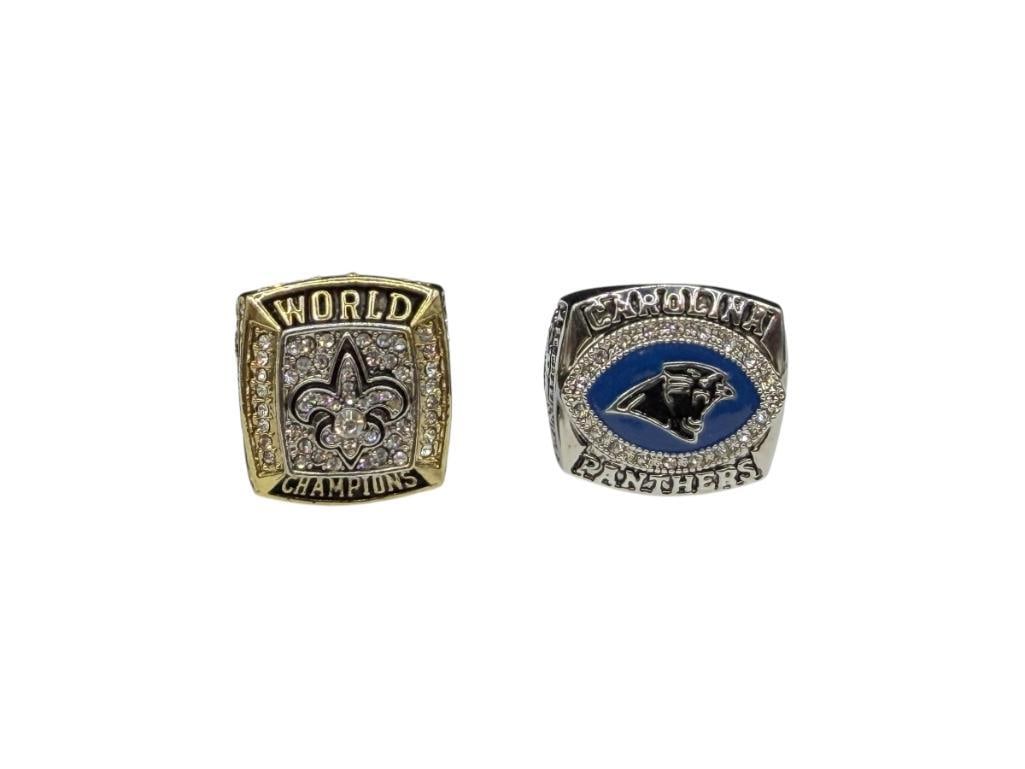 TWO NFL CHAMPIONSHIP REPLICA RINGS INCLUDING CAROLINA PAN THERS AND NEW ORLEANS SAINTS: SAINTS RINGS IS SUPER BOWL CHAMPIONSHIP REPLICA AND OTHER IS NFC CHAMPIONSHIP REPLICA, ONE GOLD TONE, BOTH STAINLESS STEEL WITH CLEAR STONE ACCENTS, DREW BREES AND JAKE DELHOMME, 2003 AND 2010 SI