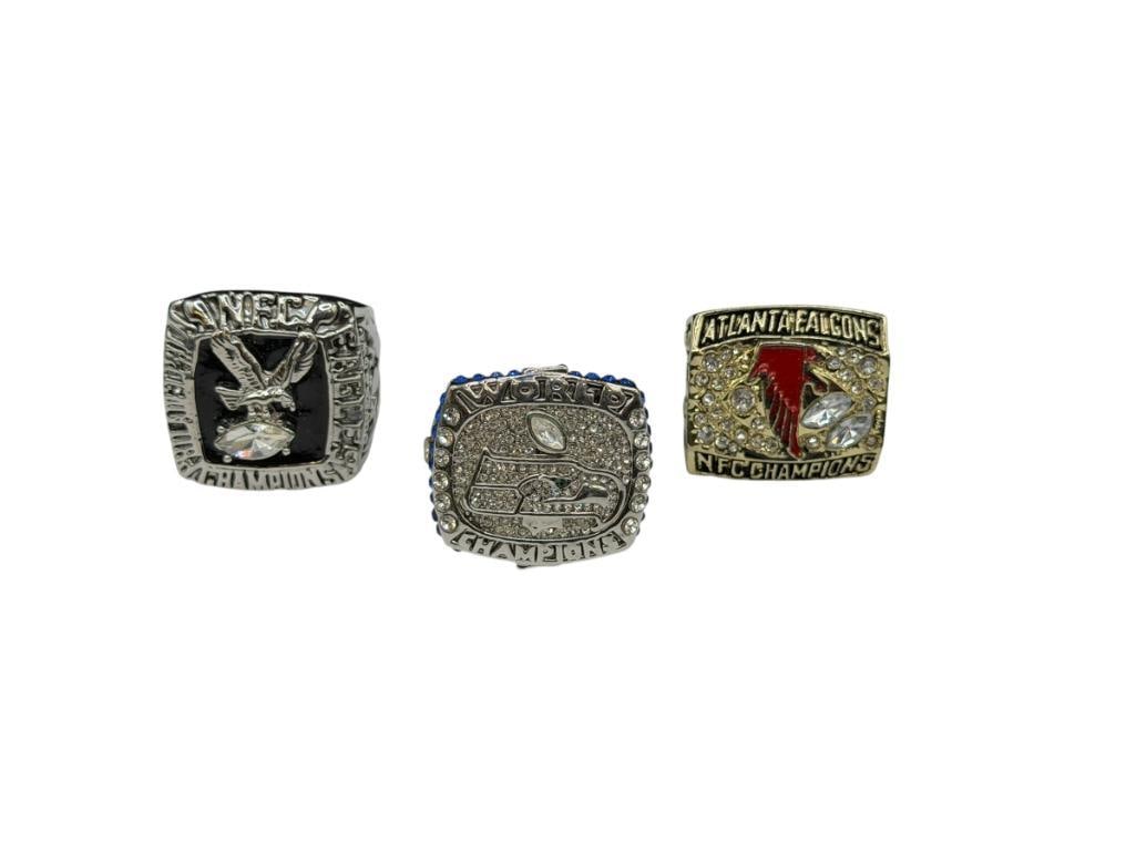 THREE NFL CHAMPIONSHIP REPLICA RINGS INCLUDING SEATLE SEAHAWKS SUPER BOWL REPLICA FROM 2013 (1 of 10)