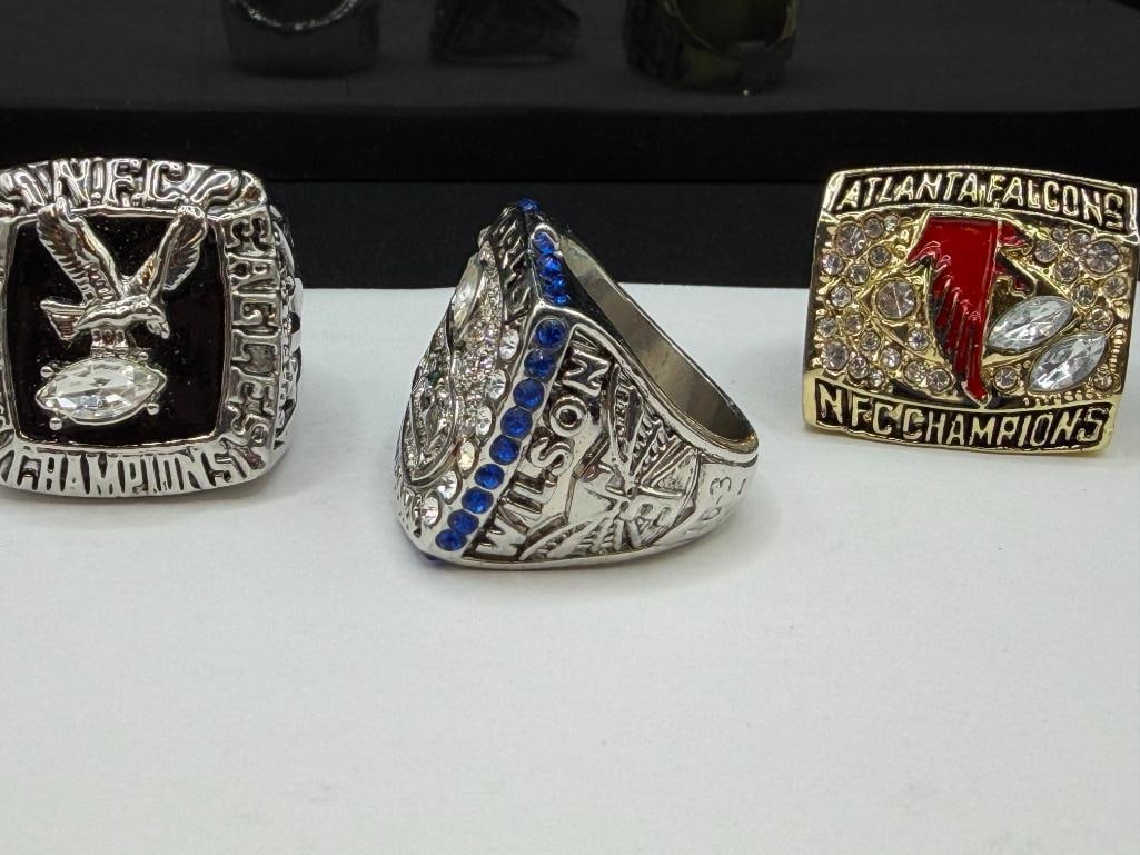 THREE NFL CHAMPIONSHIP REPLICA RINGS INCLUDING SEATLE SEAHAWKS SUPER BOWL REPLICA FROM 2013 - 3