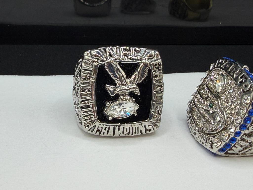 THREE NFL CHAMPIONSHIP REPLICA RINGS INCLUDING SEATLE SEAHAWKS SUPER BOWL REPLICA FROM 2013 - 4